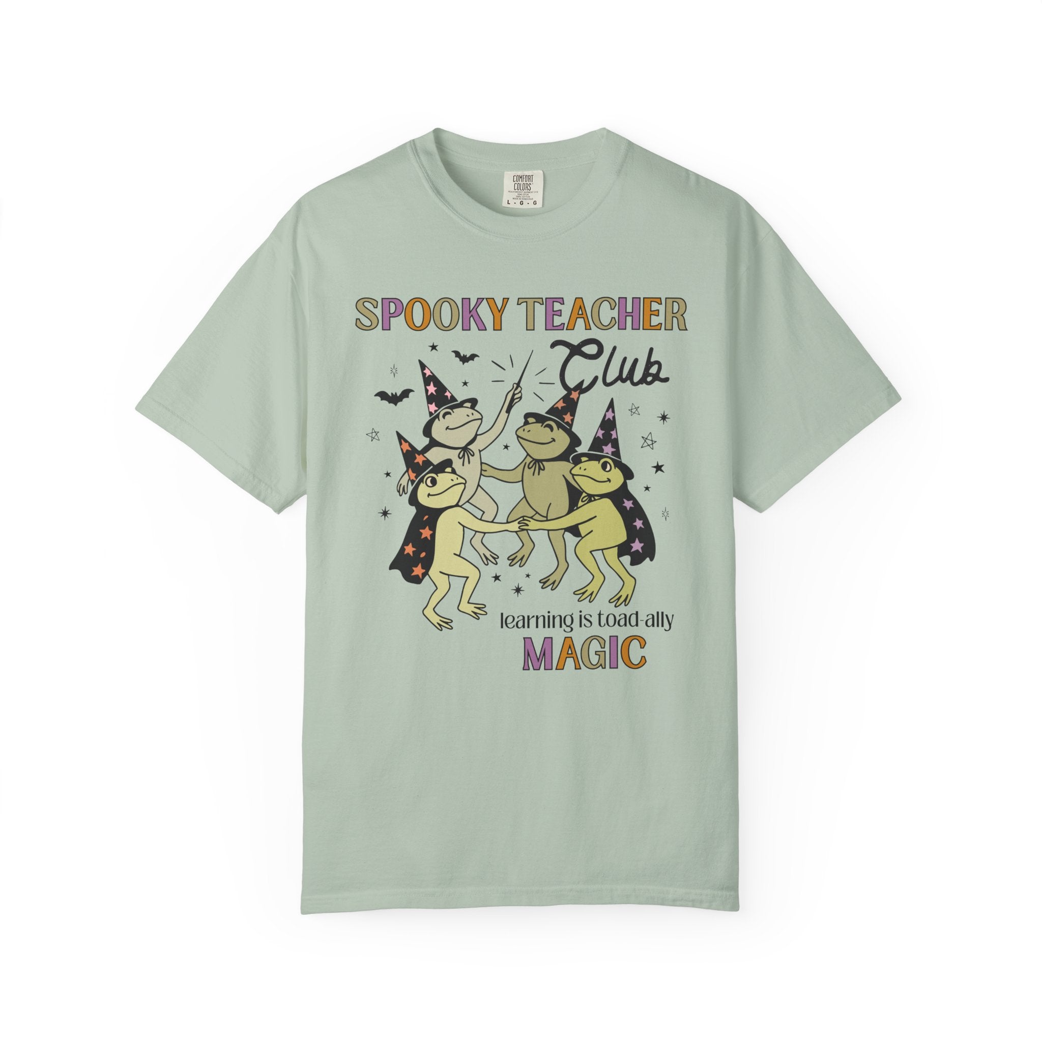 Halloween Teacher Tee Shirt with Cute Witchy Frogs: Learning is Magic! Funny Saying Spooky Season T-Shirt with Stars, Magical Animal Lover - Opal and June