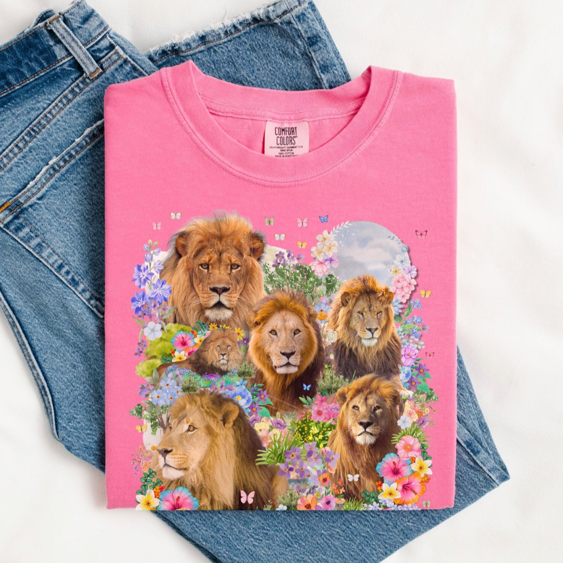 Pink t-shirt with lion design on a white background