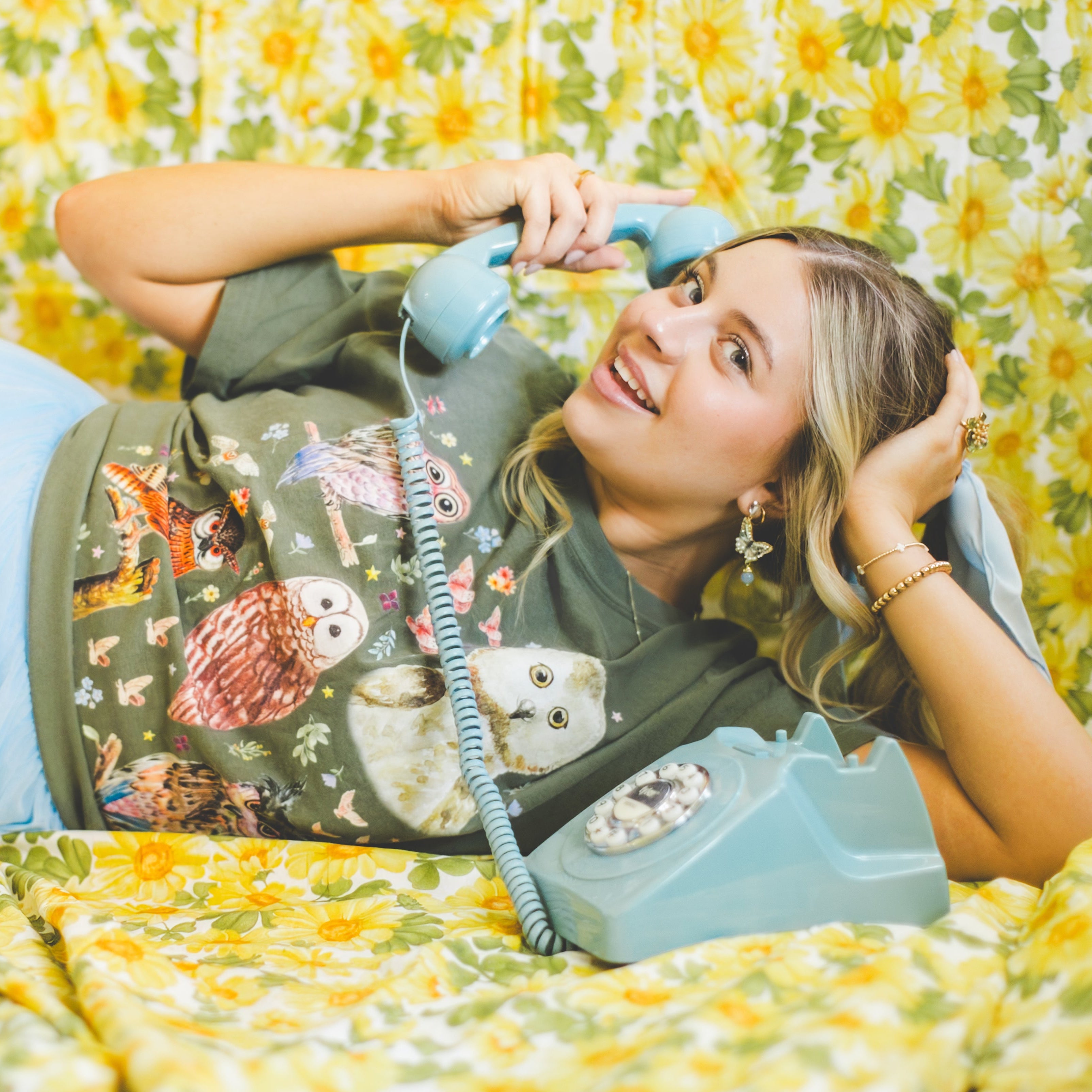 vintage aesthetic owl tee shirt with model on vintage phone