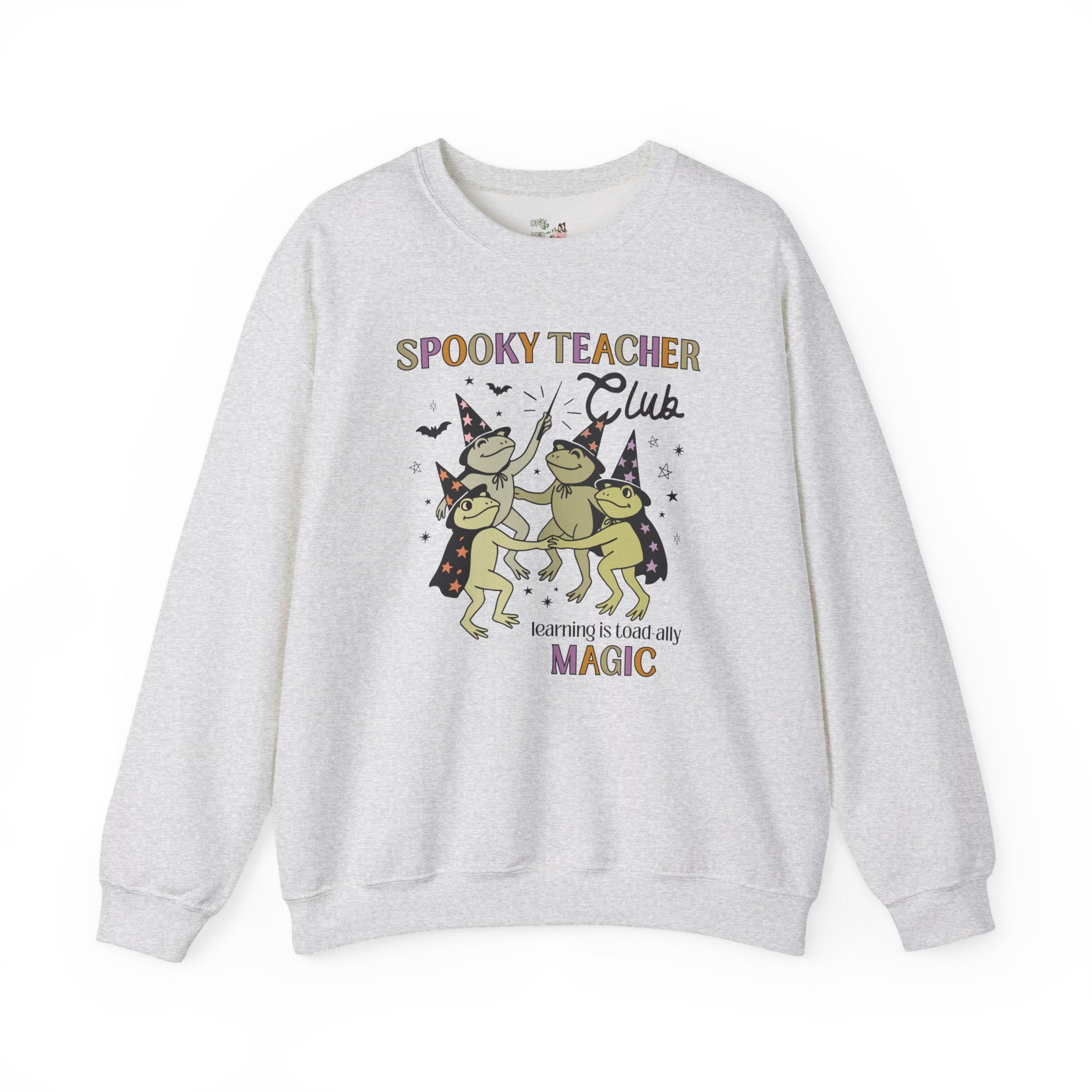 Halloween Teacher Sweatshirt with Cute Witchy Frogs: Learning is Magic! Funny Saying Spooky Season Crewneck with Stars, Magical Animal Lover - Opal and June