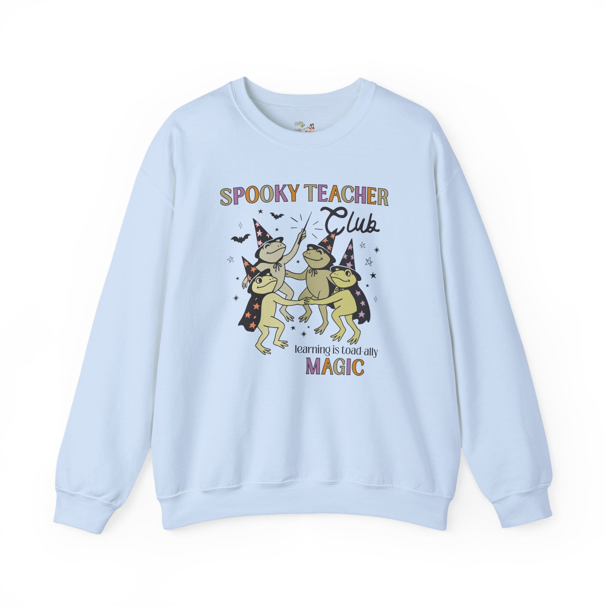 Halloween Teacher Sweatshirt with Cute Witchy Frogs: Learning is Magic! Funny Saying Spooky Season Crewneck with Stars, Magical Animal Lover - Opal and June